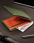 Woven leather wallet with 6 credit card slots, green with orange, lifestyle