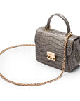 Small leather top handle bag, grey croc, side