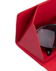 Triangular leather glasses case, burnished red, close up