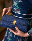 Leather clutch bag, navy croc, lifestyle view