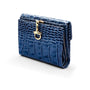 Leather purse with brass clasp, navy croc, front view