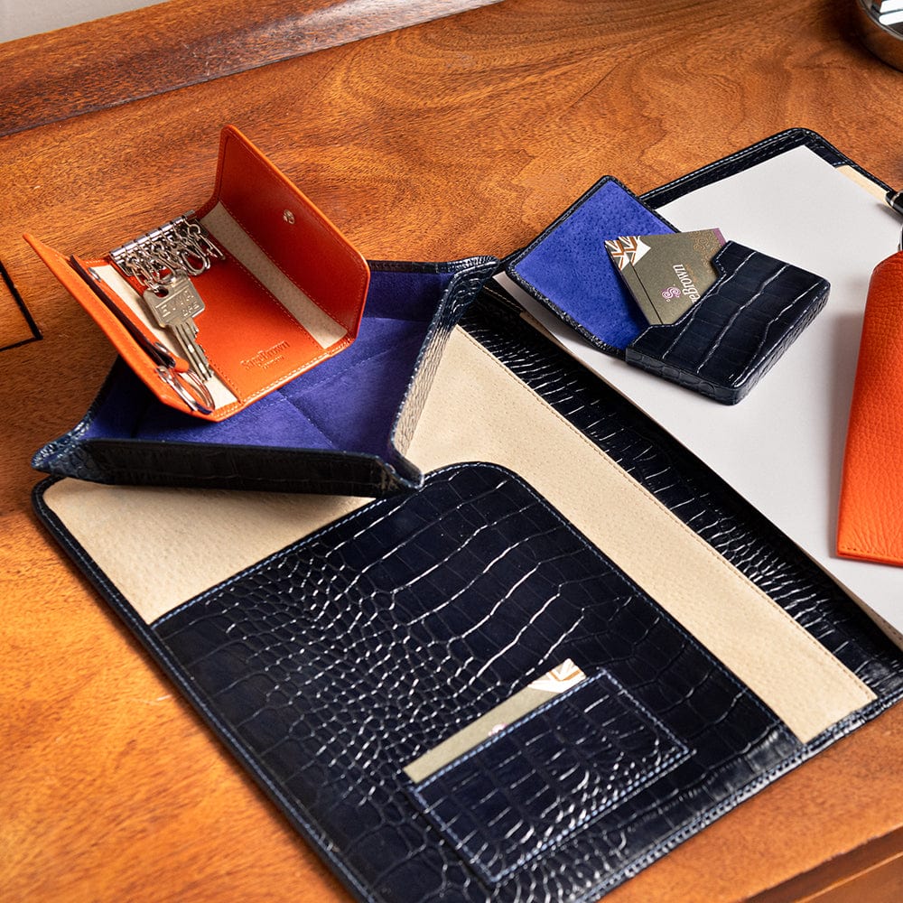 Leather business card holder with magnetic closure, navy croc, lifestyle