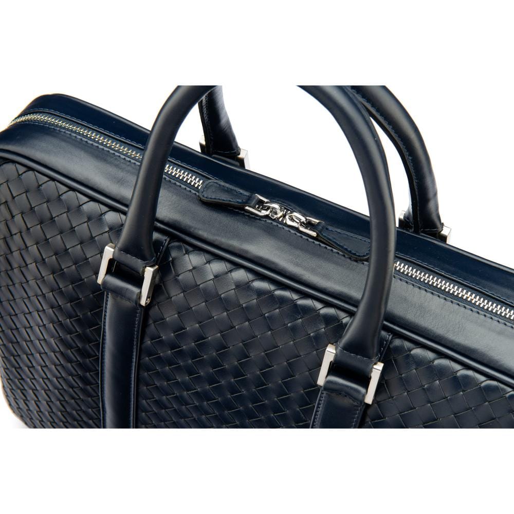 The Tressé leather laptop bag, navy woven, closeup