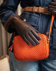 Ivy woven camera bag, orange, lifestyle