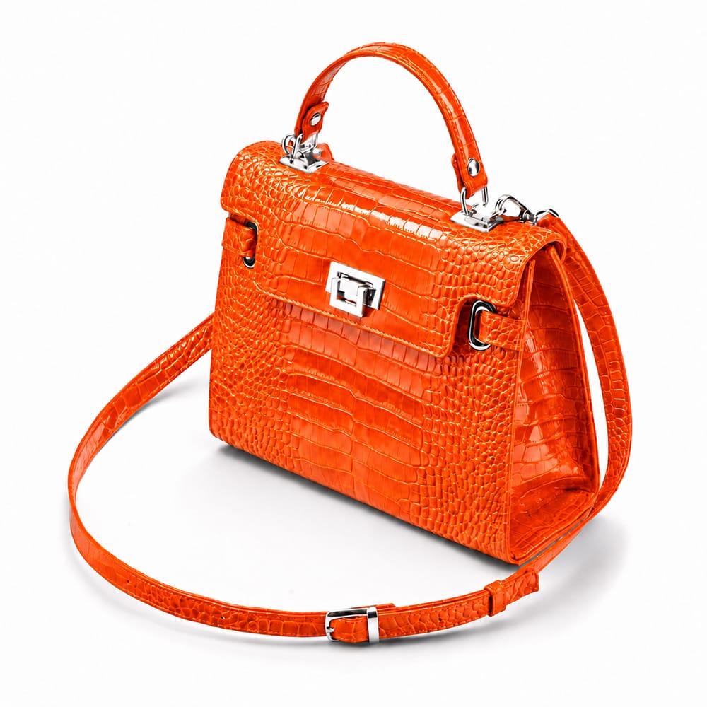 Leather Catherine top handle bag, orange patent croc, side