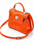 Leather Catherine top handle bag, orange patent croc, side