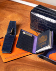 Leather travel document and currency case, orange, lifestyle