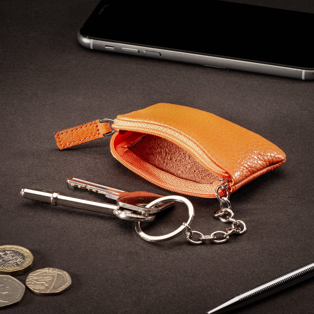 Miniature leather coin purse with key chain, orange, lifestyle