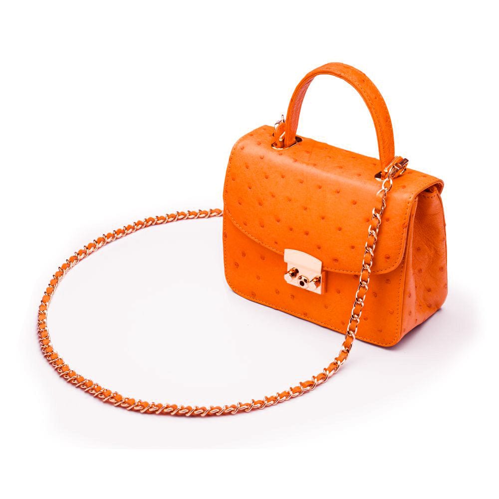 Small ostrich leather top handle bag, orange ostrich, side