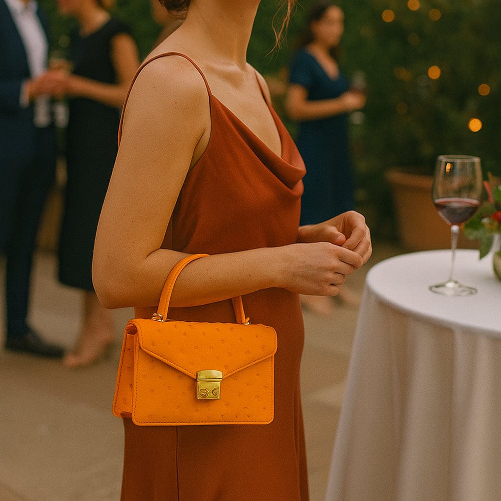 Real ostrich Maya top handle bag, orange, lifestyle
