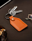 Rectangular leather key fob, orange, lifestyle