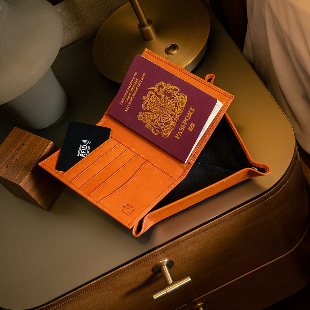 RFID leather passport holder, orange, lifestyle view