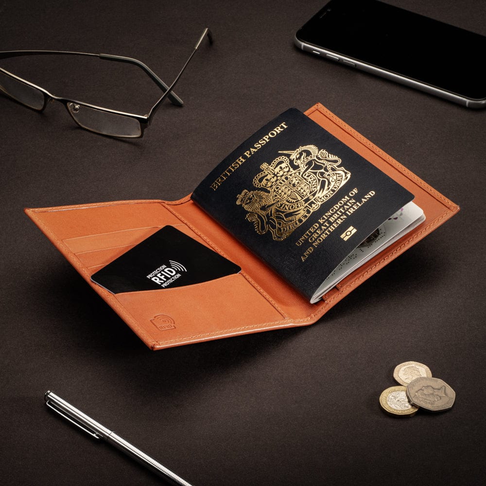 RFID leather passport holder, orange, lifestyle