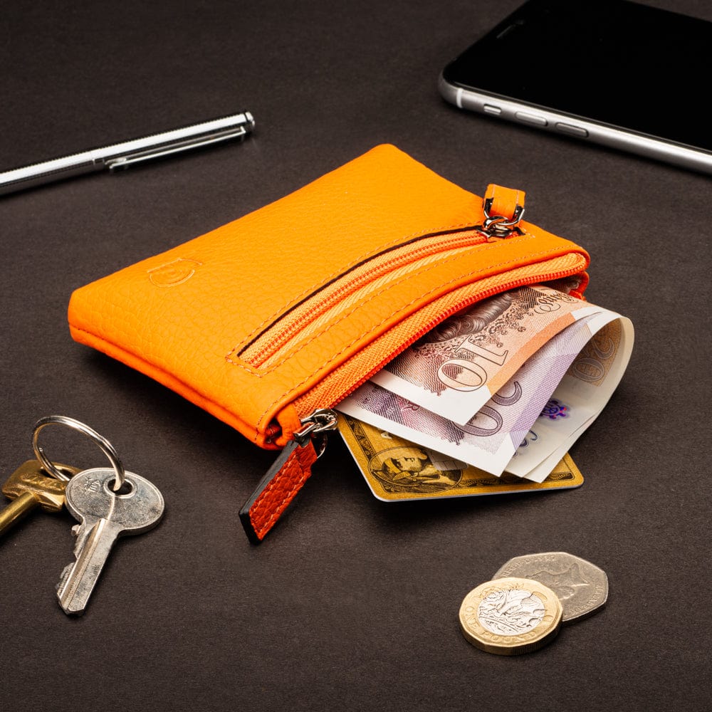 RFID Small leather zip coin pouch, orange pebble grain, lifestyle