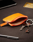 Small leather coin purse with key chain, orange, lifestyle