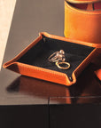 Leather valet tray, orange with black, lifestyle