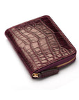 Small leather zip around accordion coin purse, dark purple croc, front