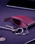 Miniature leather coin purse with key chain, purple, lifestyle