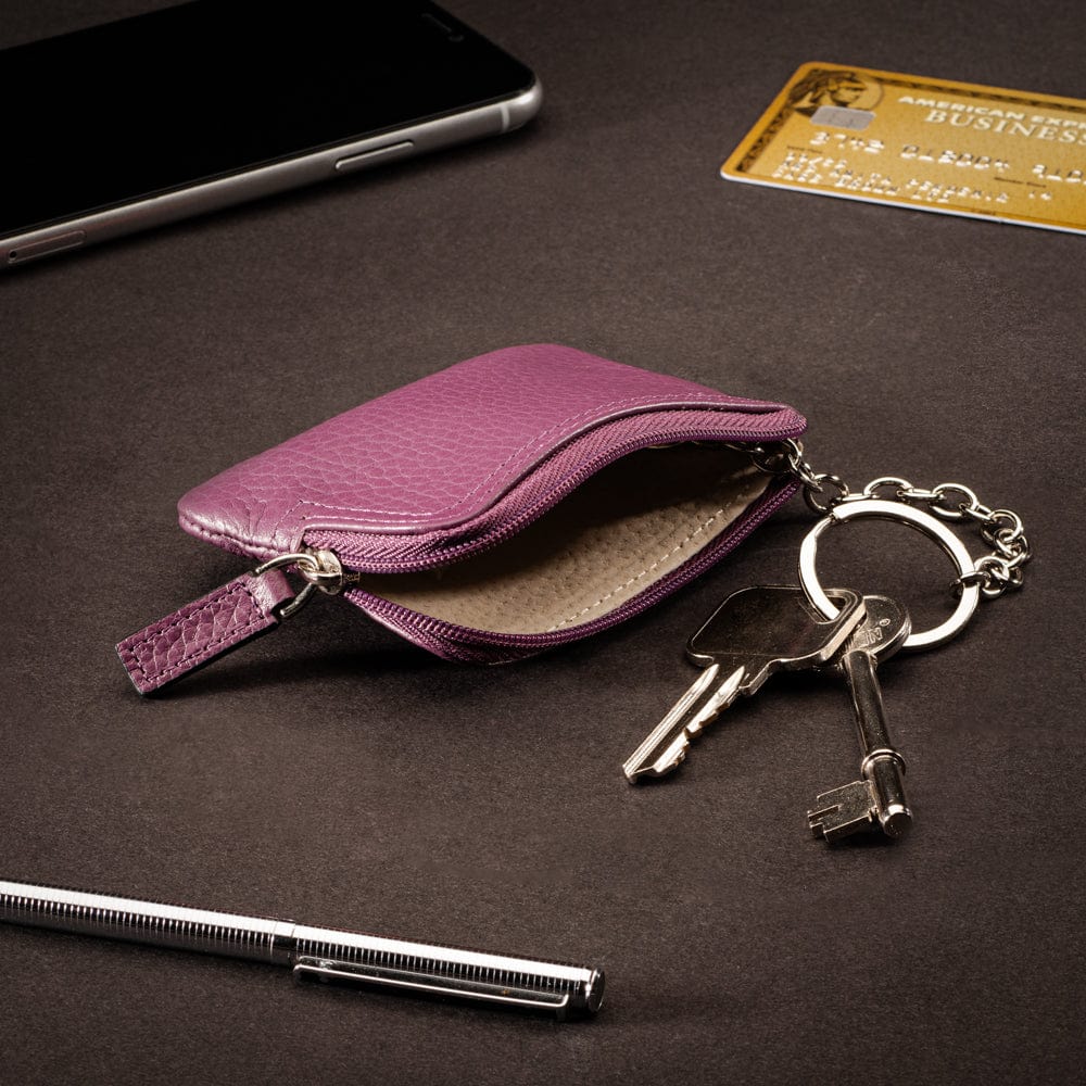 Small leather coin purse with key chain, purple, lifestyle