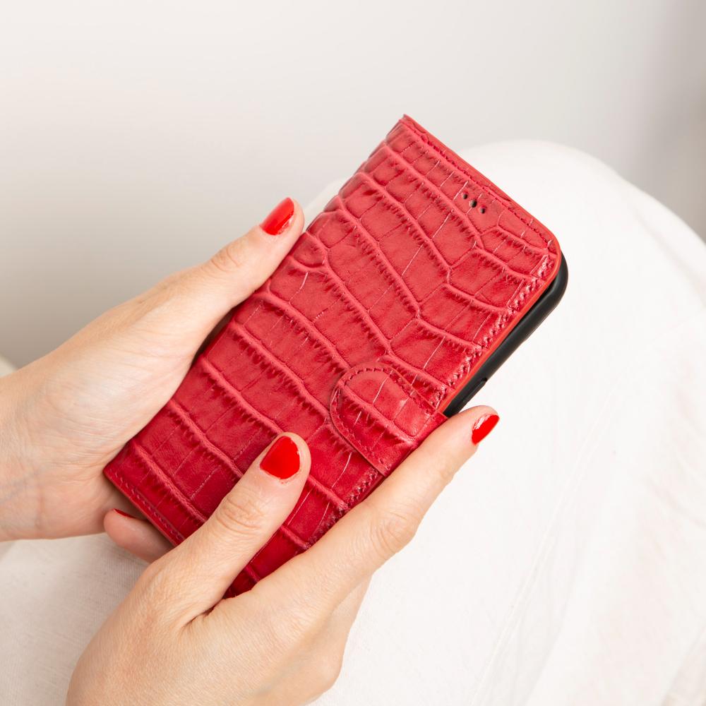 iPhone 15 case in leather with RFID, red croc, lifestyle view