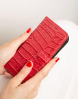 iPhone 15 case in leather with RFID, red croc, lifestyle view