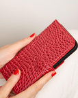 iPhone 15 Pro case in leather with RFID, red croc, lifestyle view