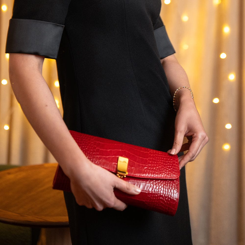 Leather clutch bag, red croc, lifestyle view