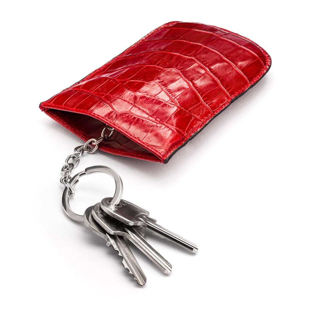Leather key case with squeeze spring opening, red croc, open