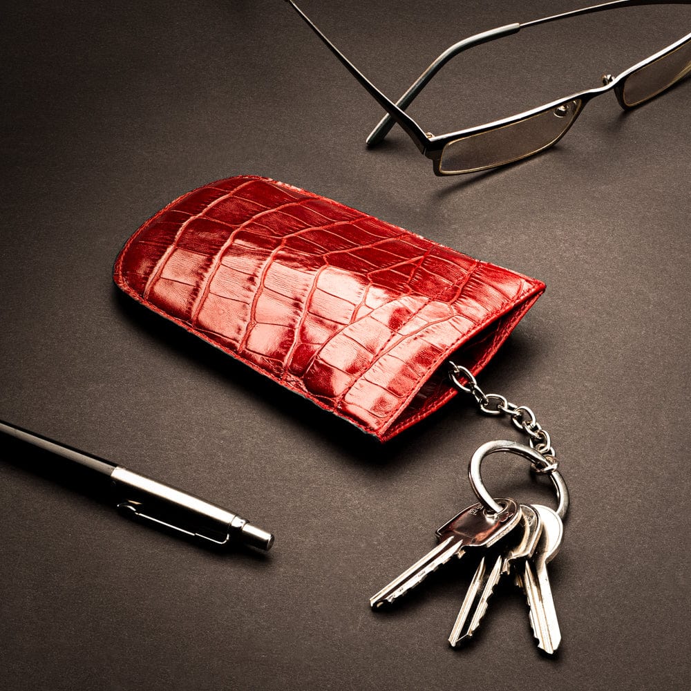 Leather key case with squeeze spring opening, red croc, lifestyle