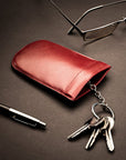 Leather key case with squeeze spring opening, red, lifestyle