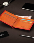 RFID wallet in bridle hide leather, red with orange, lifestyle