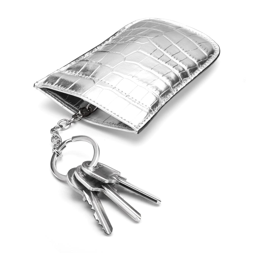 Leather key case with squeeze spring opening, silver croc, open