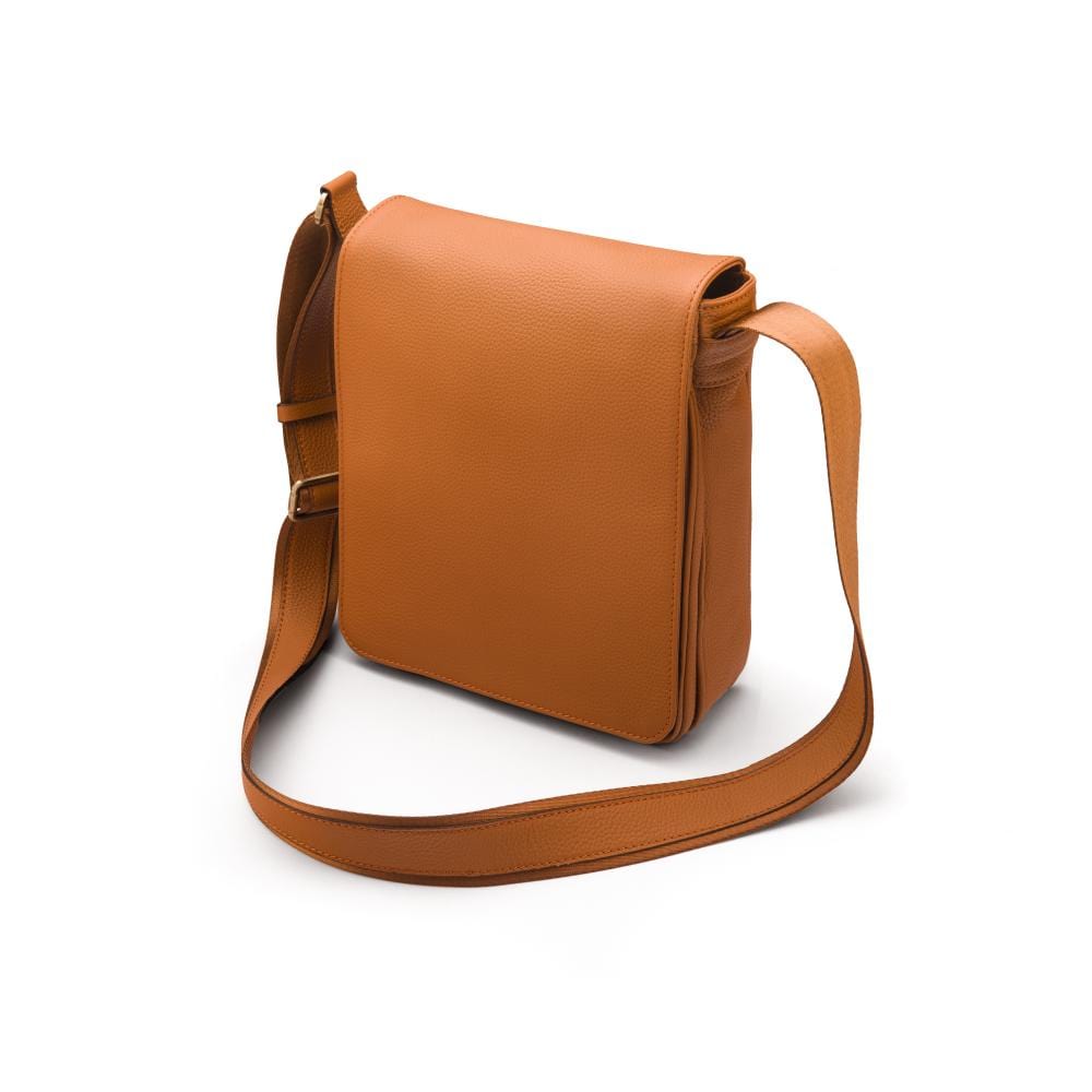 A4 portrait medium leather messenger bag, tan pebble grain, side