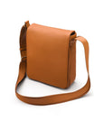 A4 portrait medium leather messenger bag, tan pebble grain, side