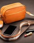 Leather cross body camera bag, tan, lifestyle