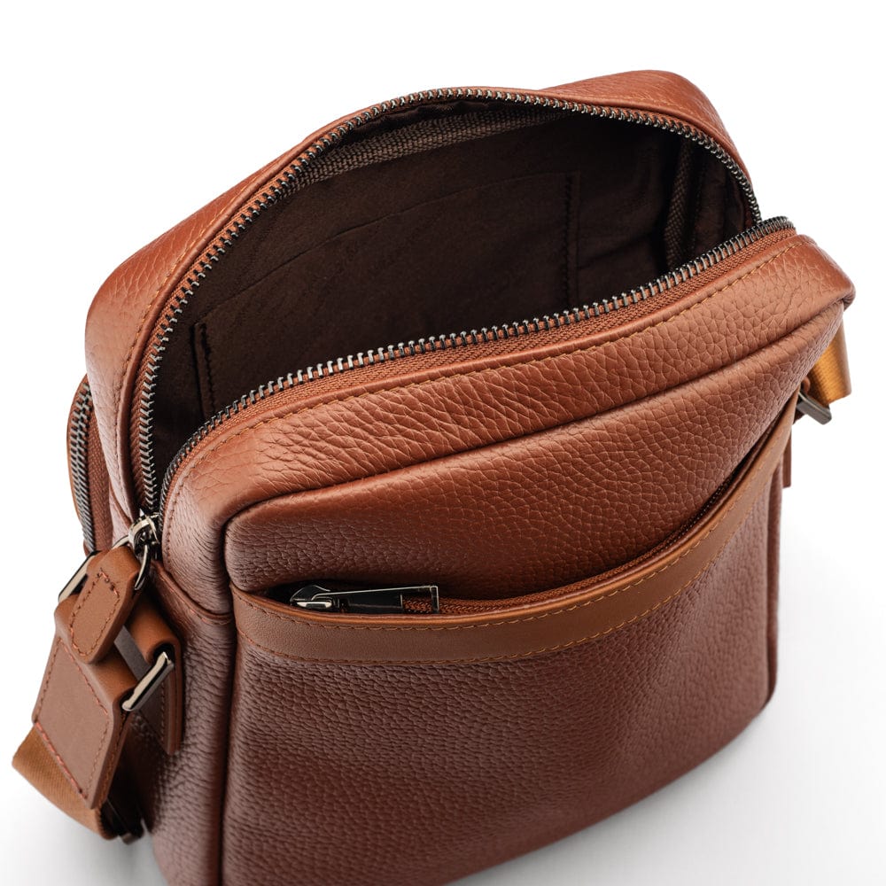 Leather messenger bag with zip, tan, open from the back view