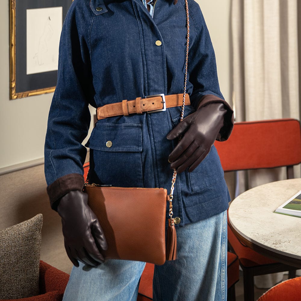 Leather cross body bag with chain strap, tan and brown gloves