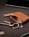 Miniature leather coin purse with key chain, tan, lifestyle