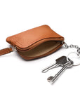 Small leather coin purse with key chain, tan, inside