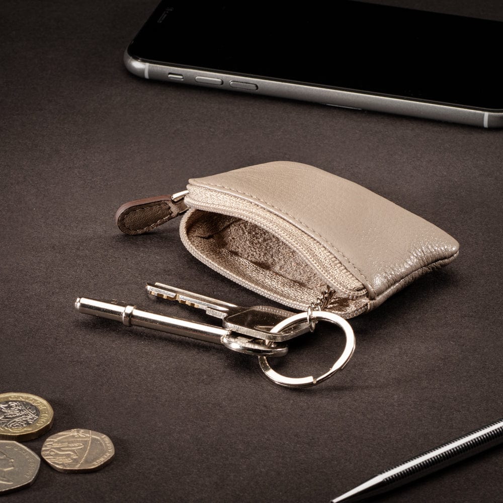 Miniature leather coin purse with key chain, taupe, lifestyle