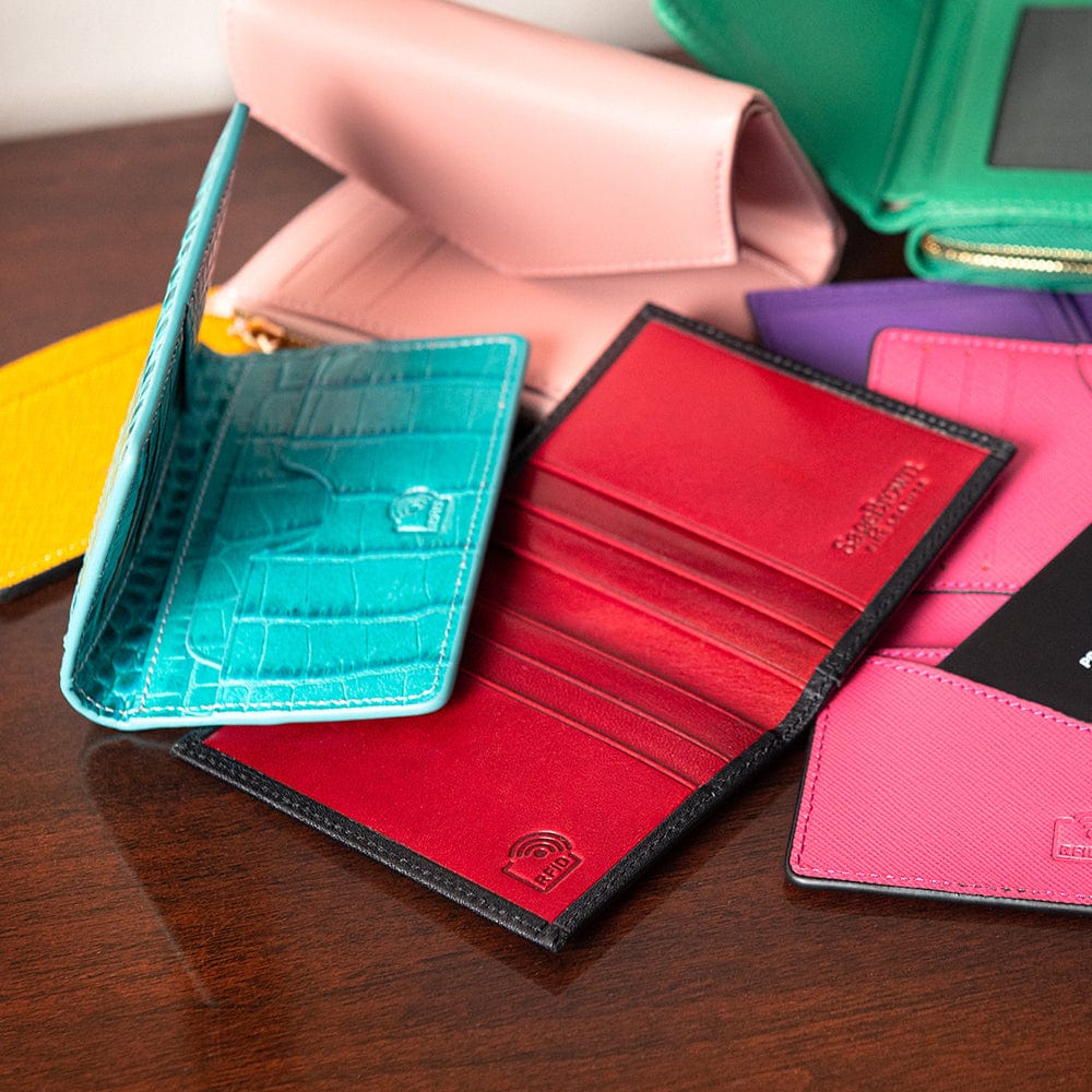Leather card holder with RFID protection, turquoise croc, lifestyle
