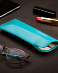 Large leather glasses case. soft turquoise, lifestyle