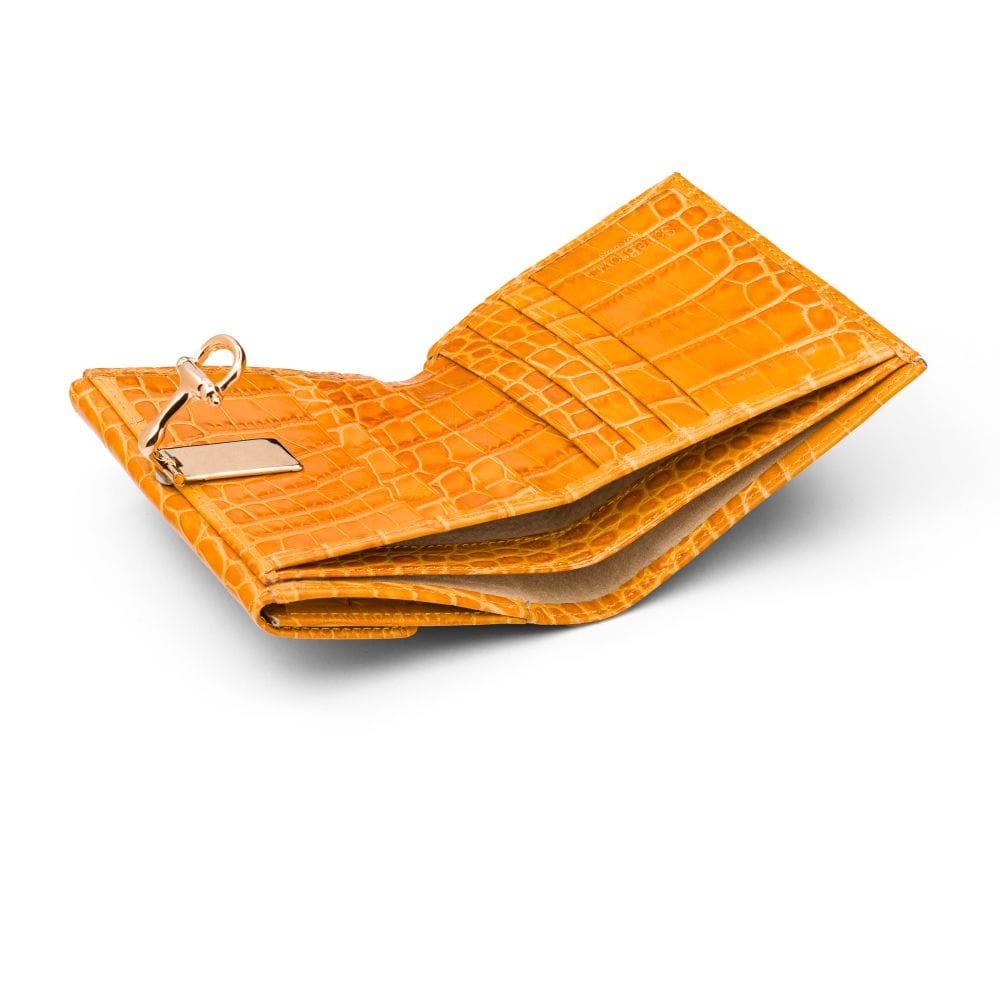 Leather purse with brass clasp, yellow croc, inside
