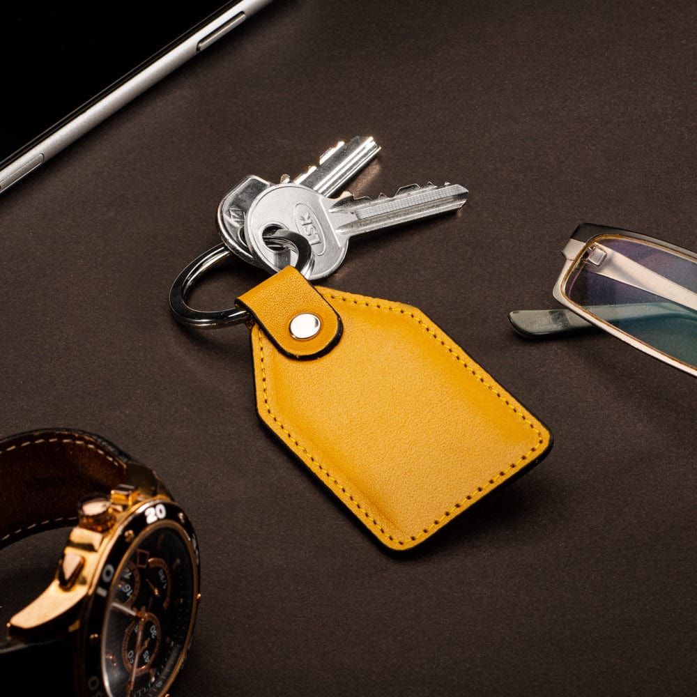 Rectangular leather key fob, yellow, lifestyle