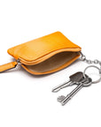 Small leather coin purse with key chain, yellow, inside