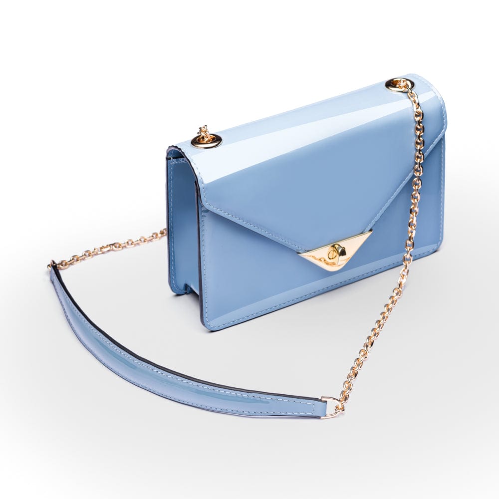 Small leather envelope chain bag, baby blue patent, side view