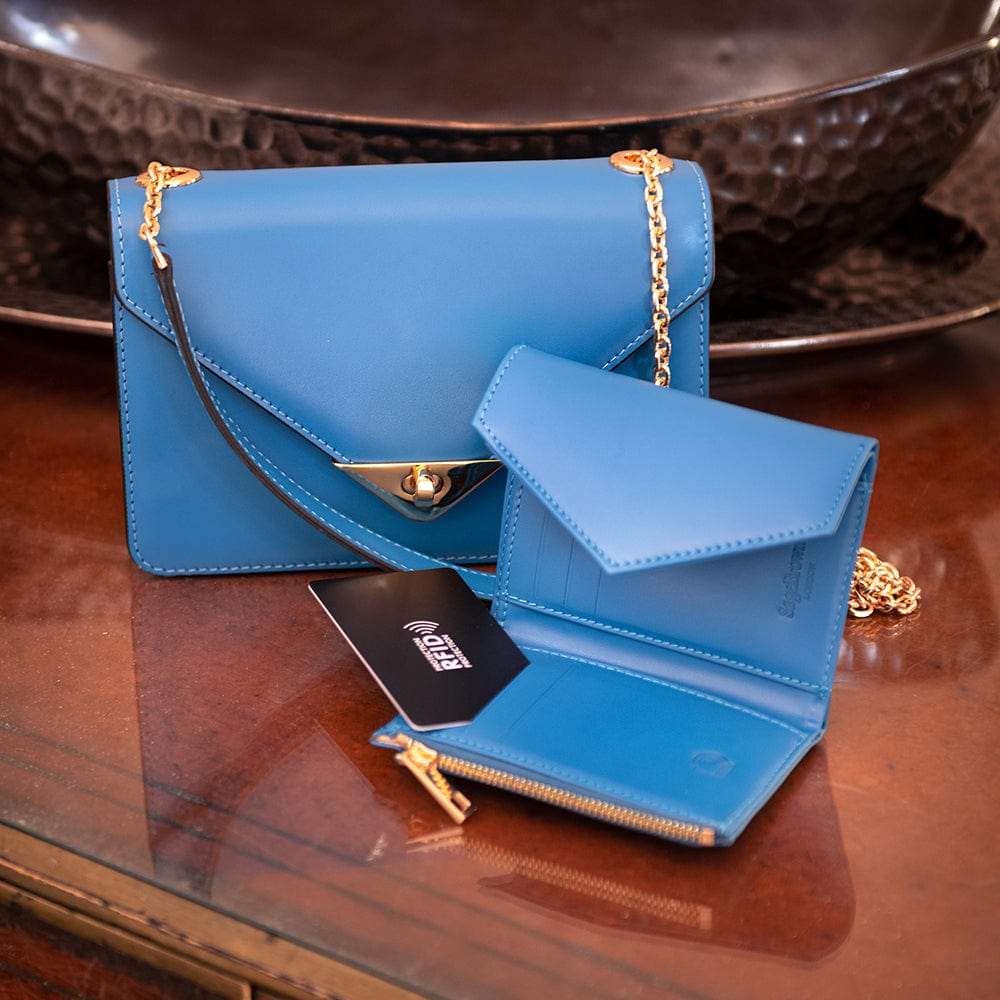 Mini leather chain envelope bag, cobalt, lifestyle view