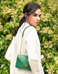 Small leather envelope chain bag, emerald, lifestyle view