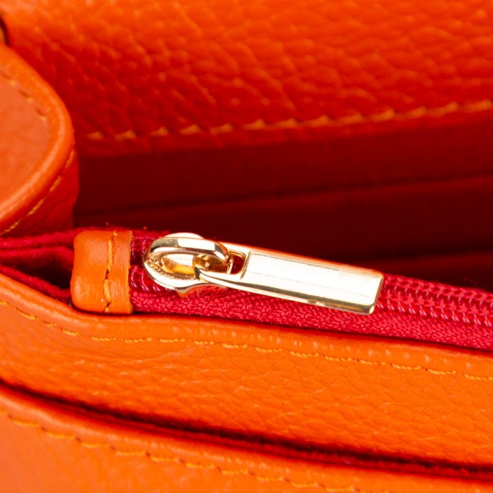 Small leather chain bag, orange, close up