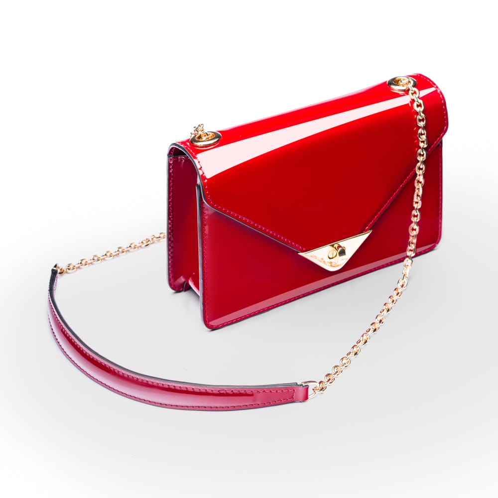 Small leather envelope chain bag, red patent, side view